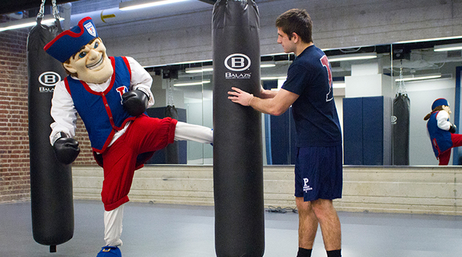 Penn's illustrous mascot demonstrates how to use gym equipment