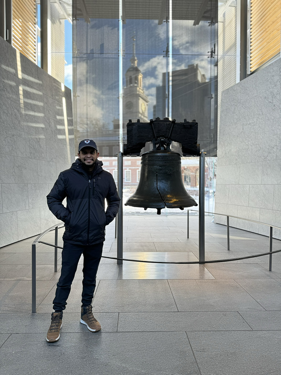 Photo of ELP student Eric G. in front of the Liberty Bell