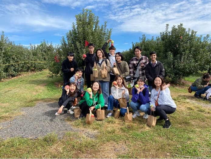 Picking apples on a bright sunny day at Linvilla Orchards